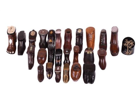 A good collection of late 18th and 19th century treen snuff boxes, in the form of boots and shoes, including an unusual sanda