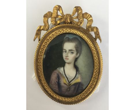 Andreas Mussard (Swiss, active 1724-1765):A portrait miniature of a lady, in decorative gilt frame, signed verso & dated 1774