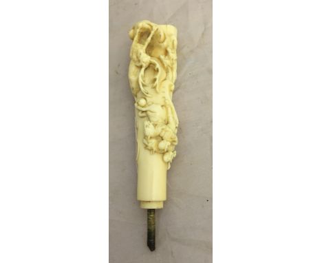 A German carved ivory parasol handle with stag hunting scene, c1880