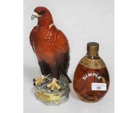 A 13.5 fluid ounces bottle of John Haig Dimple whisky with a Gleneagles Golden Eagle decanter containing 26.66 fluid ounces o