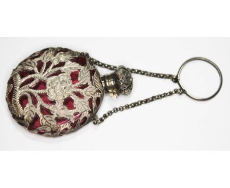 A white metal over-laid ruby glass scent bottle.  