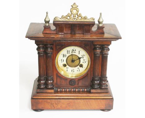 A late 19th century walnut mantle clock, height 39cm.  