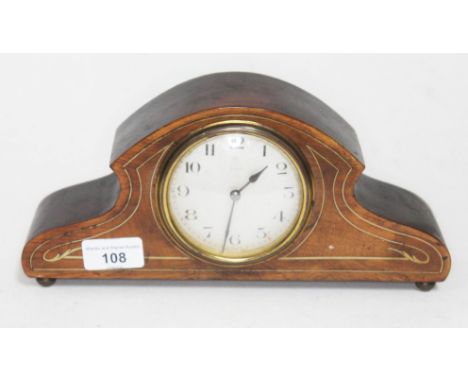 an Edwardian mahogany mantle clock.  