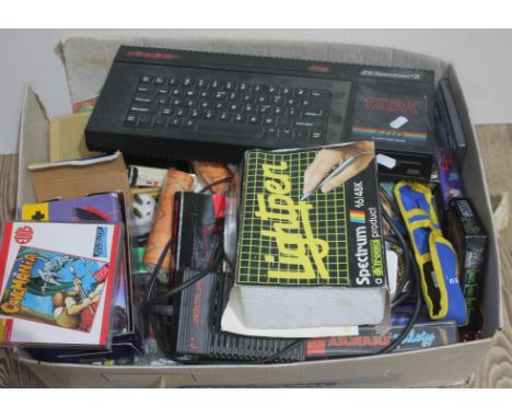 A Sinclair ZX Spectrum +3 128K with power lead, Spectrum Light Pen, and a box containing a large collection of games  
