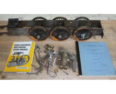 A box containing live steam items including model locomotive chassis, parts include boiler, Clarksons Model Engineer catalogu