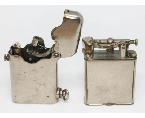 A Thorens lighter and a Dunhill lighter.  