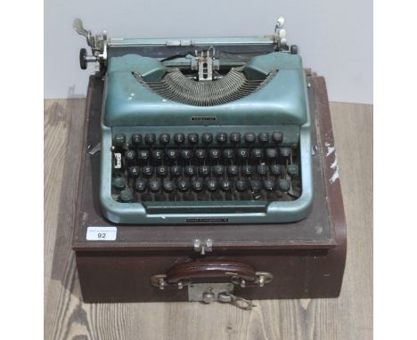 A vintage imperial typewriter with original case.  