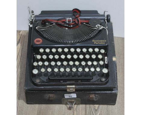 A vintage Remington typewriter, with case.  