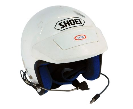 A Shoei Rally helmet, with speaker, in white.