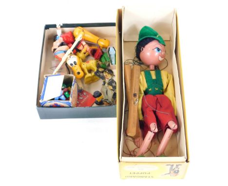 A small group of toys and games, comprising a Pelham puppet Pinocchio, boxed, Rubik' Cube, Pluto puppet, Pinocchio puppet, AA