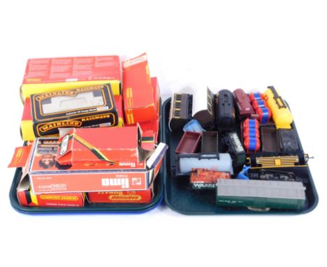 Hornby, Bachmann, Mainline and other OO gauge rolling stock, coaches, goods wagons, etc., some boxed. (2 trays)