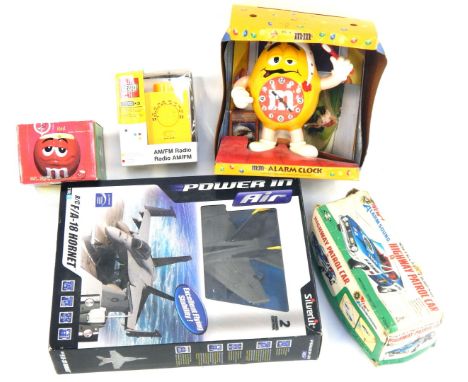 A selection of toys and games, comprising M &amp; M clock, Lego radio, M &amp; M character mug, a highway patrol car New alar