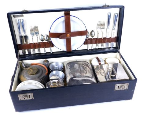 A Coracle vintage picnic hamper, by G W Scott &amp; Sons, in a black painted wooden case, four place settings, with silver pl