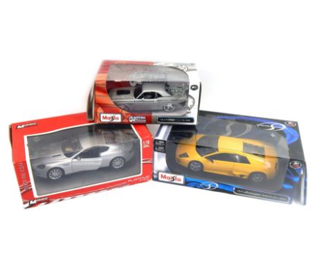 Three diecast model cars, comprising a Maisto 1:14 scale 1970 Dodge Coupe, Monda Motors Platinum Collection Aston Martin DB9 