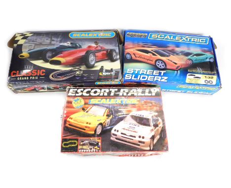 Three Scalextric boxed sets, comprising Escort Rally, Street Sliderz, and 5000 Classic Grand Prix. (3)