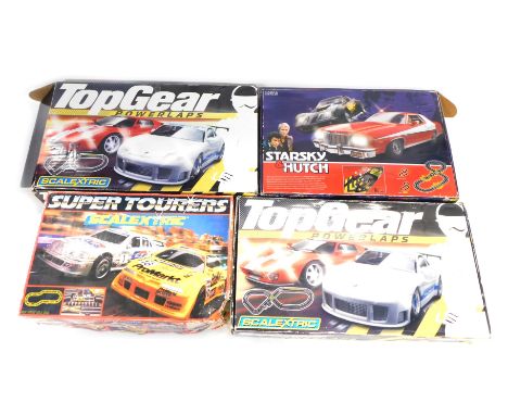 Four Scalextric sets, comprising Top Gear boxed set, further Top Gear set, Super Tourers and a Marks and Spencer Starsky and 