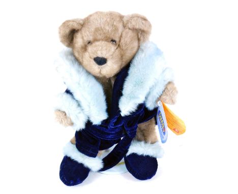 A Chad Valley Puddle Club Teddy bear, on stand, 36cm high.