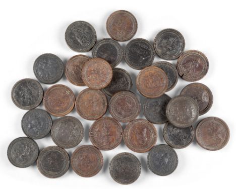 A group of thirty German relief-impressed fruitwood and ebonised games counters, in the manner of Martin Brunner, 18th centur