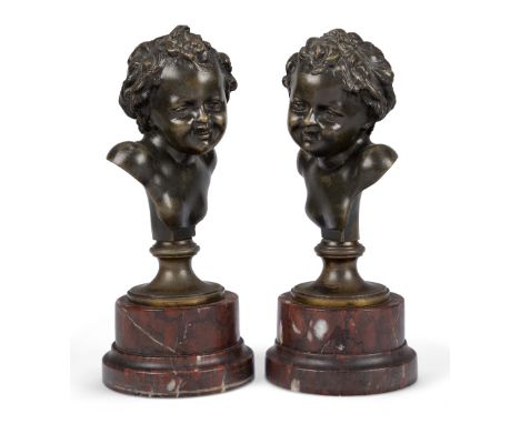 A pair of French bronze busts of children, late 19th century, each on a rouge griotte marble plinth, 25cm high (2)Provenance: