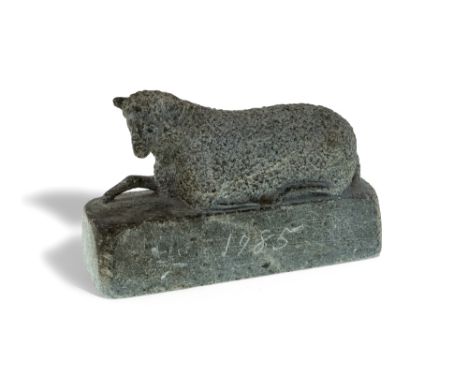 An American Folk Art stone carving of a recumbent sheep, c.1825, the rectangular integral base inscribed 1795, 9cm high, 13cm