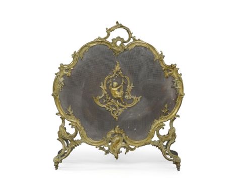 A French gilt bronze fire screen, late 19th century, with foliate scroll border set with a cherub cartouche, 71cm x 66cm Prov