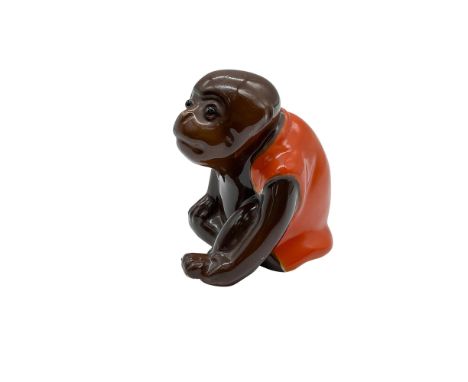 Rare hand modelled and hand painted figure of a brown seated monkey in an orange vest and glass eyes. Bernard Moore marked.Ar