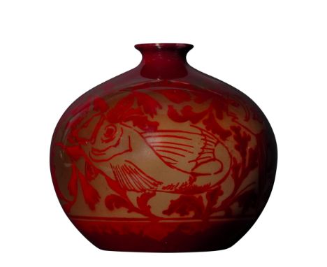 This vase features a flambe glaze in deep red tones, covering a sgraffito-style fish and aquatic foliage motif around the rou