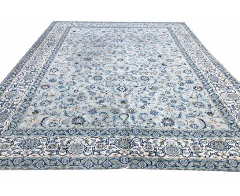 FINE PERSIAN ISPHAHAN DESIGN CARPET, 390cm x 307cm, all over plamette and vine design on a jade field within corresponding bo