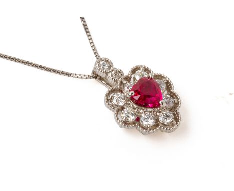 A RUBY AND DIAMOND PENDANT WITH CHAIN
Featuring a heart shaped ruby weighing approximately 0.52 cts (marked), mounted in a pl