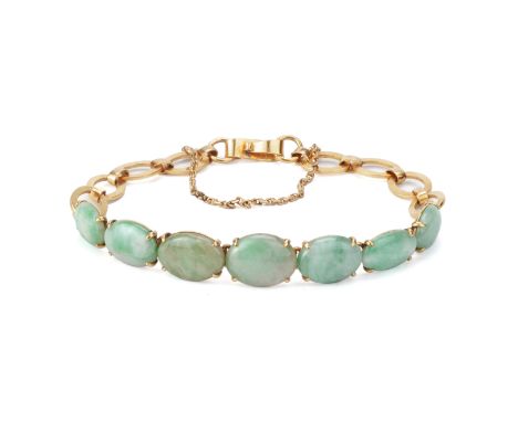 A JADE AND GOLD BRACELET
Featuring cabochon jade mounted on a gold bracelet marked '22K' to the reverse, together with other 