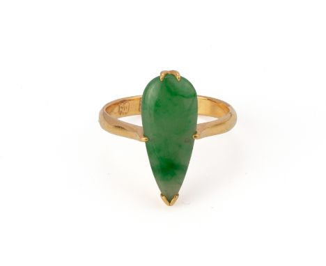 A JADE AND GOLD RING
Featuring a pear shaped jadeite mounted on a yellow gold setting marked 22k to the shank, alongside othe