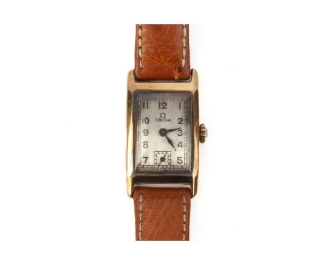 AN OMEGA LADIES GOLD WRISTWATCH
Circa 1930s 
18k gold rectangular case, silvered dial with Arabic numerals and subsidiary sec