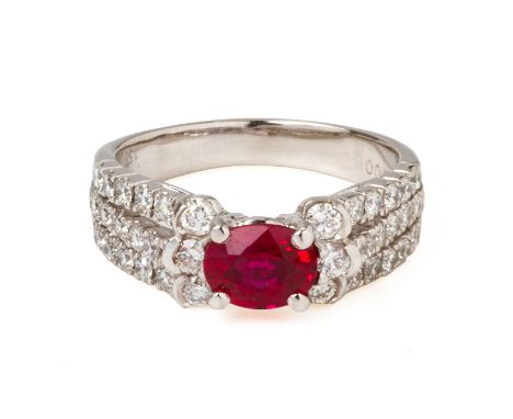 A RUBY AND DIAMOND RING
Featuring an oval cut ruby weighing approximately 1.21 cts (marked), in platinum setting accented wit