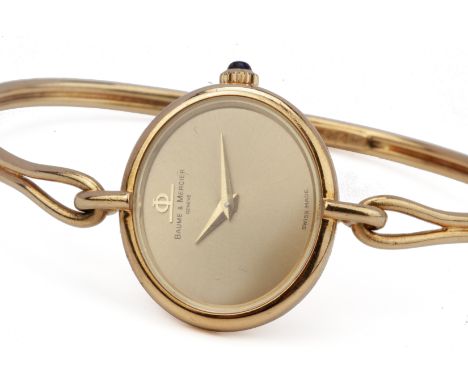 A BAUME &amp; MERCIER LADIES GOLD BANGLE STYLE WATCH To be sold at no reserve Case No. 553155 38244T2, circa 1990s 18k gold o