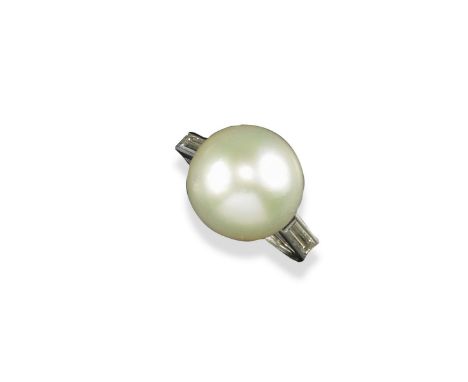 A cultured pearl and diamond set ring by Boucheron, the pearl measures 14.05mm and is set with two baguette-shaped shoulder d