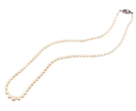 A single-row cultured pearl necklace, the pearls graduate from 3.1 to 6.9mm. The platinum boat-shaped clasp set with diamonds