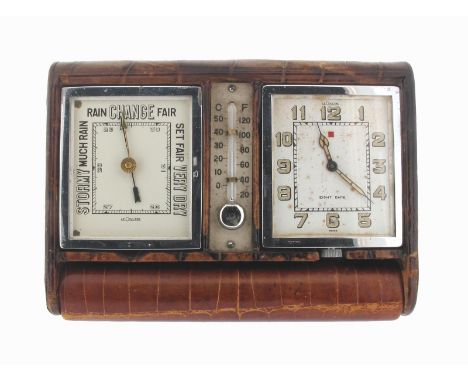 A travelling desk clock with barometer and thermometer mounted in a leather-bound book form case, the square-form barometer w