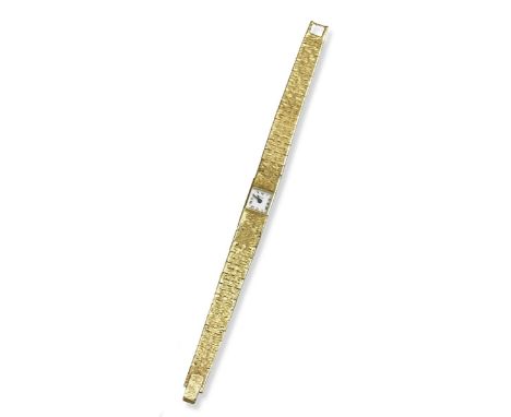 A lady's gold wristwatch by Piaget, the square white dial with black Roman numerals on textured 18ct yellow gold band. Manual