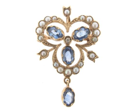 A sapphire and seed pearl set gold brooch pendant, set with oval-shaped sapphires and graduated seed pearls in yellow gold.