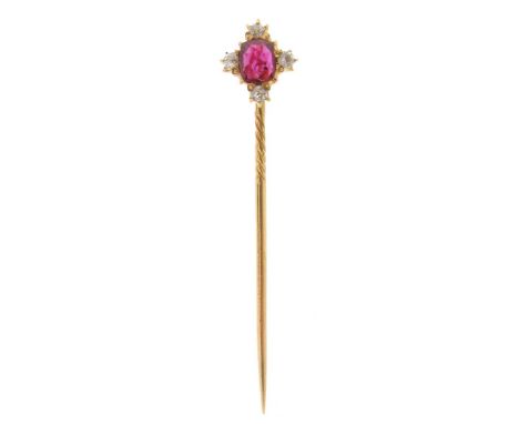 A ruby and diamond set pin, the oval-shaped ruby is set with four small circular-cut diamonds in gold. Accompanied by report 