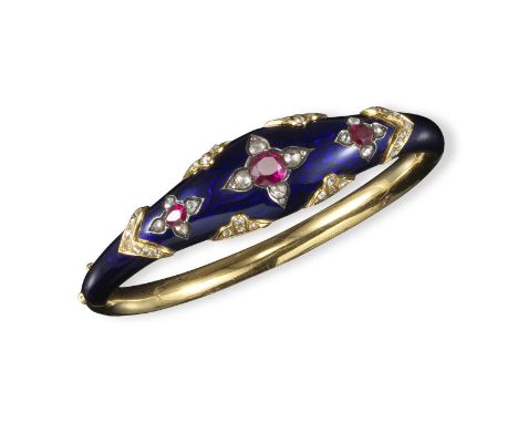 A Victorian diamond and ruby set gold hinged bangle, centred with three graduated oval-shaped rubies each set with four rose-