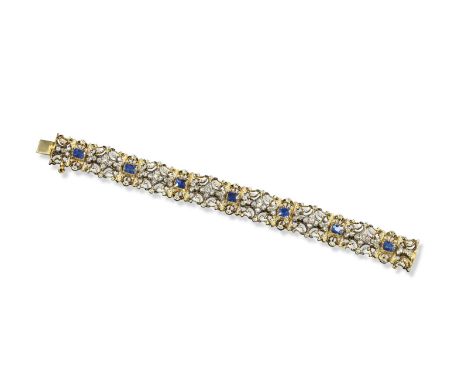 A Renaissance Revival gold bracelet set with sapphires and diamonds by Carlo and Arthur Giuliano, formed with scroll pierced 