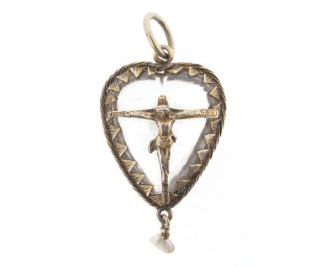An antique religious pendant, the heart-shaped crystal is set within a silver gilt mount and applied with a motive of Christ 