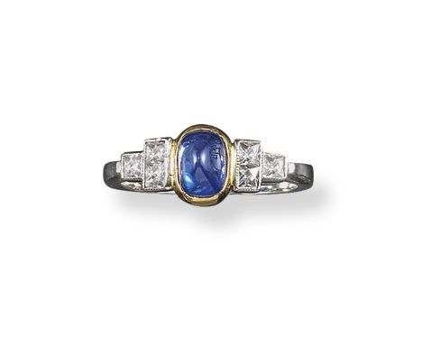 A cabochon sapphire and diamond seven stone ring, the central sugarloaf sapphire is set within six French-cut diamonds in yel