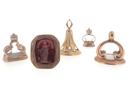 Five assorted 19th century gold and gold-cased fob seals, one mounted with a carnelian matrix engraved with the profile of a 