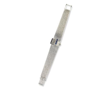 A lady's gem-set wristwatch by Patek Philippe, the rectangular signed dial with silver baton numerals, with a hinged rectangu
