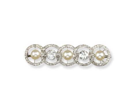 An Edwardian diamond and natural pearl set brooch, formed as five conjoining circles each centred with a natural pearl or tra