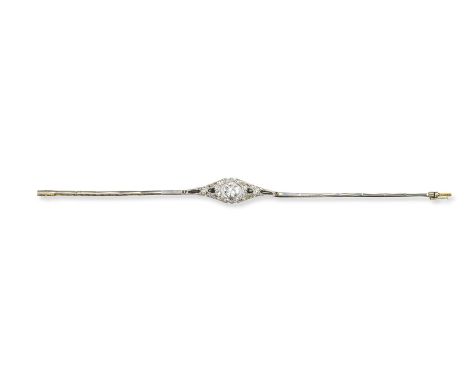 An Edwardian diamond bracelet with black enamel decoration, the centre oval-shaped diamond weighs approximately 0.95cts and i