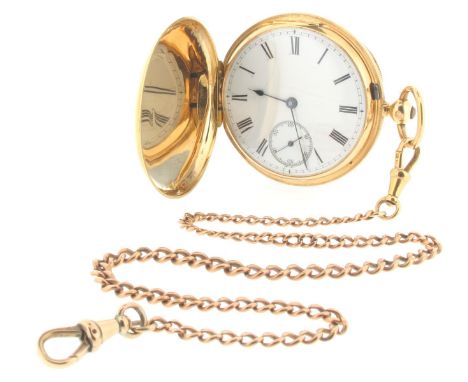 An 18ct yellow gold hunting cased pocket watch, white enamel dial with black Roman numerals and subsidiary seconds dial. Fron