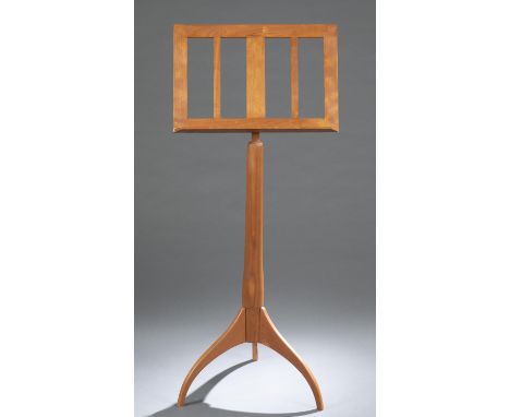 A Shaker Workshops cherry music stand. 21st century. Ashburnham, Massachusetts. Cherry adjustable music stand on tripod pedes